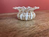 side view showing ruffled rim and cane pattern