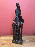 full view of Richard Kramer steel family sculpture on base