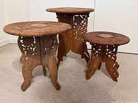 All three carved folding tables assembled