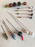 Full group of stick pins and beads on tabletop