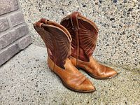 Boots side view showing shaft stitching and side zippers