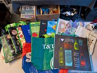 Assortment of reusable grocery bags spread on table