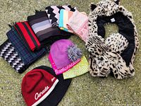 Group shot of all scarves and hats laid out