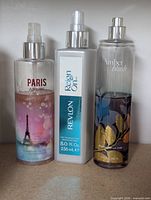 Bath & Body Works Paris Amour, Revlon Regen On, Bath & Body Works Amber Blush bottles front view
