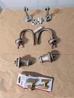 Overview of all hooks and holdbacks laid out on paper