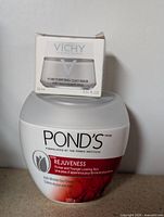 Pond's Rejuveness day cream jar with Vichy clay mask box on top