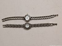 Overall view of both watches laid flat