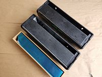 Top view of two black Eze Wrap units and bamboo dispenser