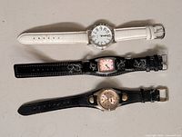 Three watches laid out showing overall style and straps