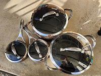 Top view of all four KitchenAid pots with lids