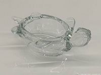 Side view of clear crystal turtle dish showing head, legs, bowl shape