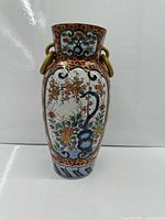 Front view of Imari porcelain vase showing decoration and handles