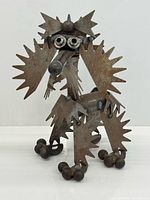 Full view of welded metal poodle sculpture