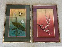Both framed Asian style art prints side by side