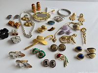 Full layout of all jewelry pieces on white surface