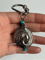 Front view showing Pisces motif, beads, and clasp