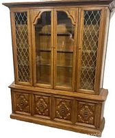Full front view of china cabinet showing glass display top and buffet base