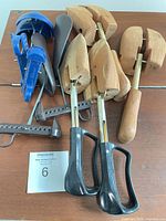 Group shot of all five pairs of shoe stretchers on table