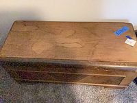 Top view of cedar chest showing stains and wear