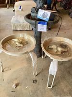 Two cream basins on white stands with boxed Pulaco pump visible