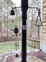 Group view: small four-tube chime, bell, triangle, watering can ornament