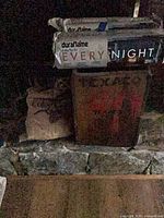 Two Duraflame packs and paper bag of kindling