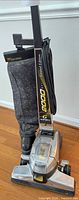 Front view of Kirby 2000 Limited Edition upright vacuum showing base, handle, cord, cloth bag, logo and graphics