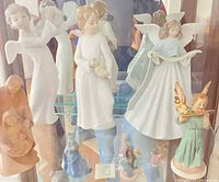 Cabinet view showing all five figurines