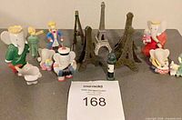 Full lot showing figurines, Eiffel Towers, wine bottle