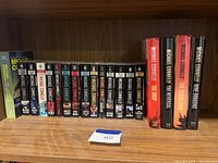 Full shelf view showing 17 Michael Connelly books