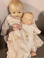 Three vintage baby dolls grouped together