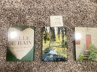 All three wood wall signs laid out on carpet