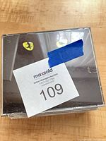 Stack of CDs with Cats cover visible