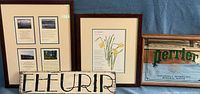 Group view of all four items: two framed prints, Perrier mirror sign, Fleurir wooden sign