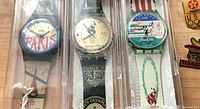 Three Atlanta 1996 Swiss-made watches in clear cases
