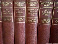 Six volumes showing spines with gilt titles and Author's National Edition imprint