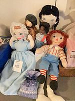 Group shot of all five dolls displayed together