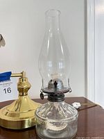 Clear pressed glass oil lamp with metal burner and chimney