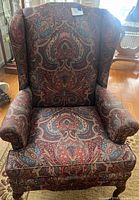 Front view of paisley wingback chair