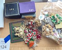 Lot overview with boxes and loose holiday jewelry