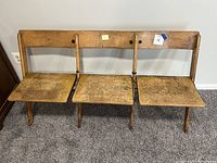 Front view showing three connected seats and backs