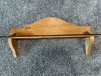 Natural wood wall shelf, front view