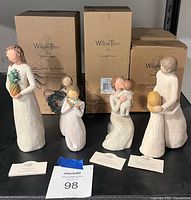 Overall lot showing five Willow Tree figurines with three original boxes and sentiment cards