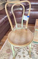 Full view of chair showing bentwood back and seat