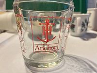 Front view showing Anchor logo and glass body