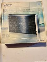 Front of retail box showing Antec MX-100 enclosure image and branding