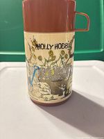 Front view showing Holly Hobbie graphic and side handle
