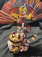 Front view of Shinobu Oshino statue with accessories and backdrop