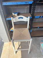 Full view of stool showing design and condition