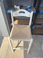 Full view of white wooden bar stool showing overall style and condition